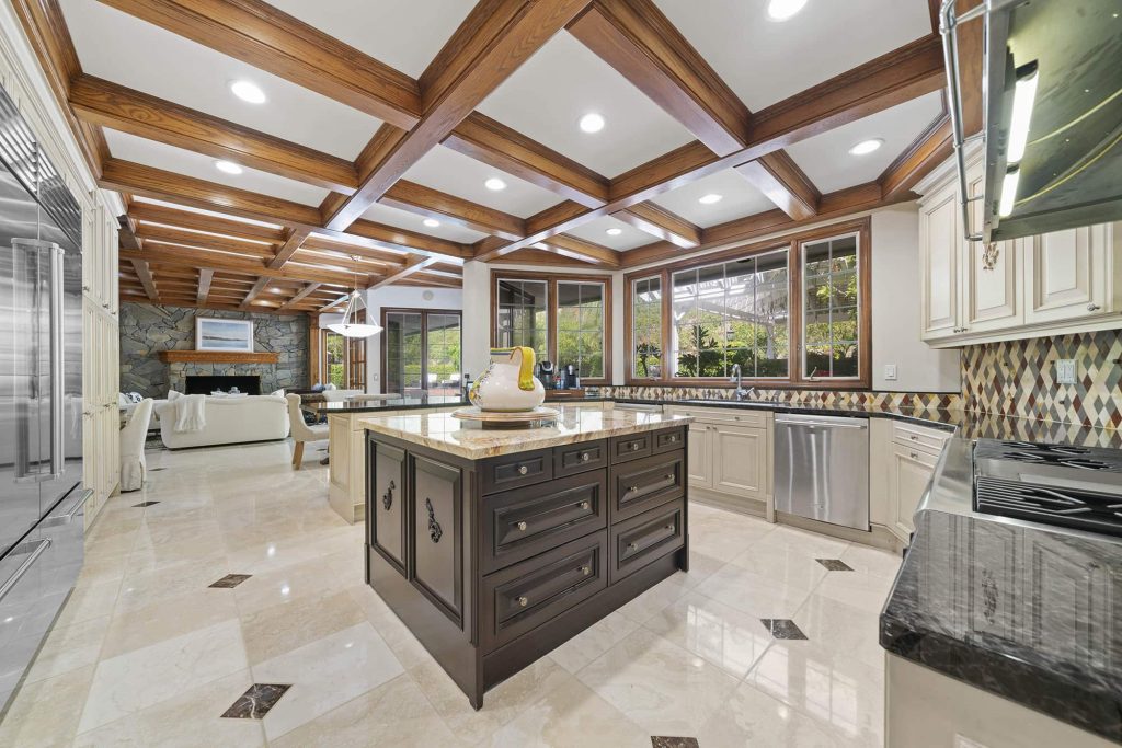 Kitchen With Coffered Ceilings And Large Center Island