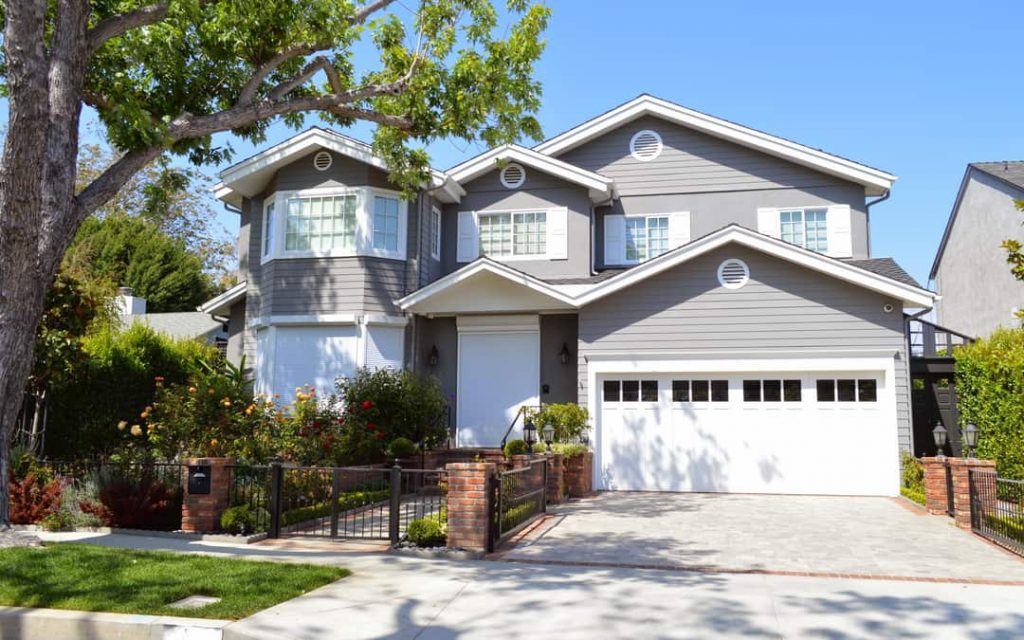 Modern custom made houses and mansions with nicely landscaped front the yard in the suburbs of Los Angeles, CA.