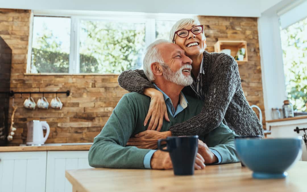 Shot of a mature woman hugging her husband