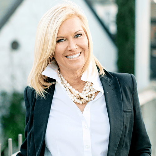 Sue La Bounty headshot wearing white shirt and black jacket